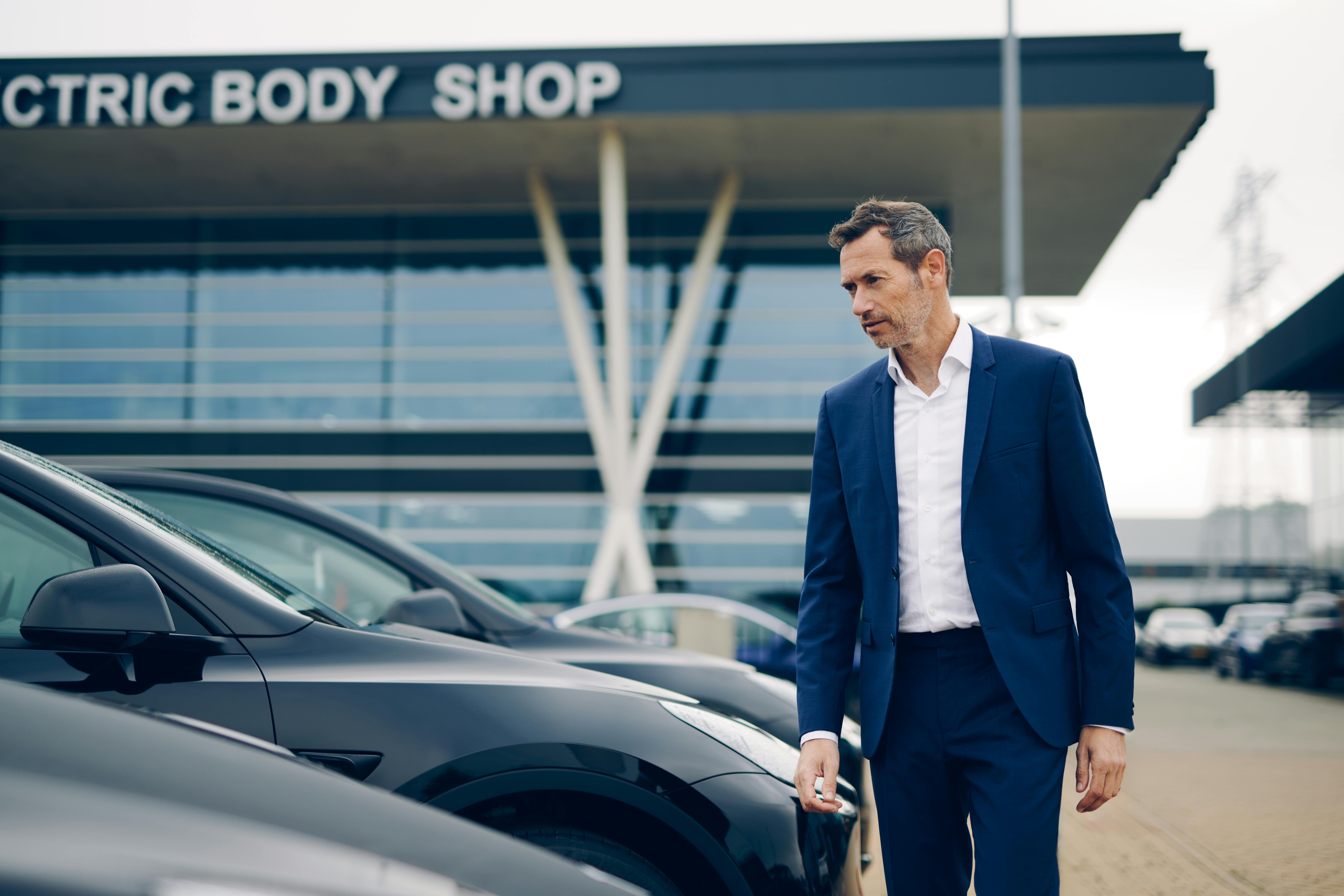 Fleet manager inspecting cars